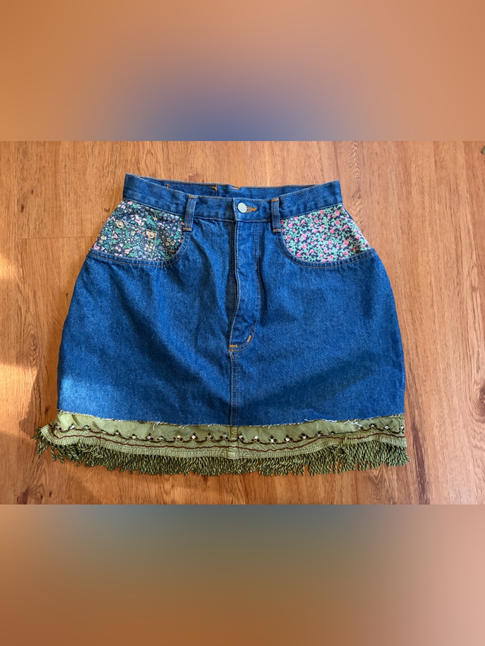 Gitano Blue Denim Mini Skirt with Floral Pockets and Green Fringe